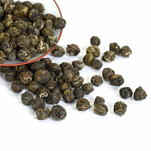 Jasmine dragon pearls tea on white background.
